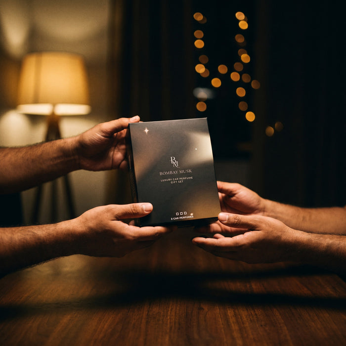 The sealed Luxury Car Perfume Gift Set · 2 Perfumes being handed over