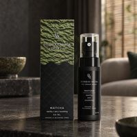 Matcha Ice Cream Spray bottle and box together on a console table